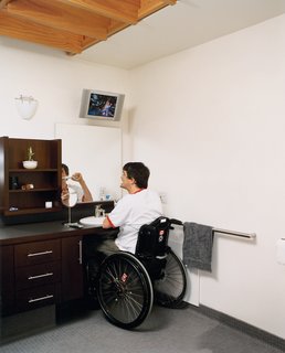 In the master bath, a different kind of view is afforded by a wall-mounted TV that can be seen from almost everywhere in the room—ensuring that Siple doesn’t have to miss even a minute of his beloved hockey games.