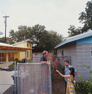 Andy and Regina greet their neighbor Dan Morris, owner of the Beckham-designed house.