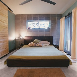The platform bed in the master bedroom was crafted by a local woodworker.
