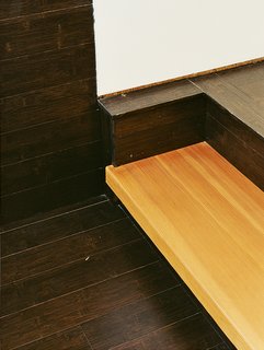 Fir stair treads are cantilevered off the wall with a custom steel support to create an industrial look.