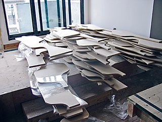 Plywood pieces are stacked in sequential order in readiness for installation in the Deform House.