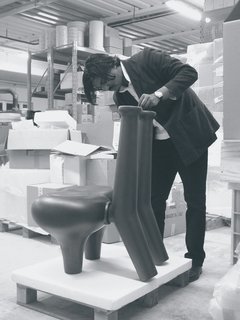 Pure and Symbol - Photo 2 of 10 - Pakhalé works on a chair model in his factory. He spends up to six months working on prototypes.