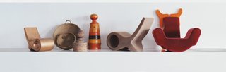 Pure and Symbol - Photo 3 of 10 - A lineup of Pakhalé’s working models, including two prototype versions of the Fish chair, designed for Cappellini. The simple forms are used to dramatic effect when the materials vary, from Corian to bent glass.