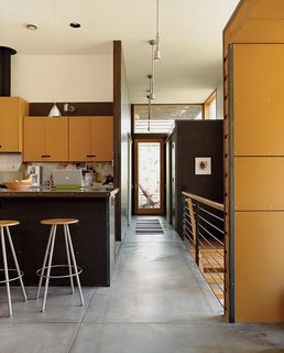 Oiled concrete floors inform the interior of the Stanwood residence.