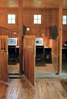 The stalls provide the same demarcated, cozy space for concentration as a cubicle, but the effect is warm and rich rather than garish and chintzy.