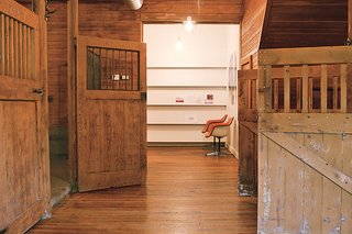 The only white walls in this office (left) belong to the former carriage garage turned critique room.