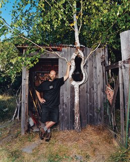 Branching Out - Photo 2 of 6 - Richard Reames, next to one of his custom creations.