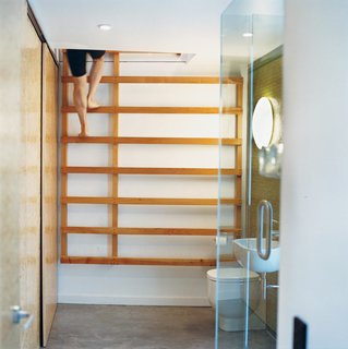 One bathroom features a ladder that leads up to a yoga studio.