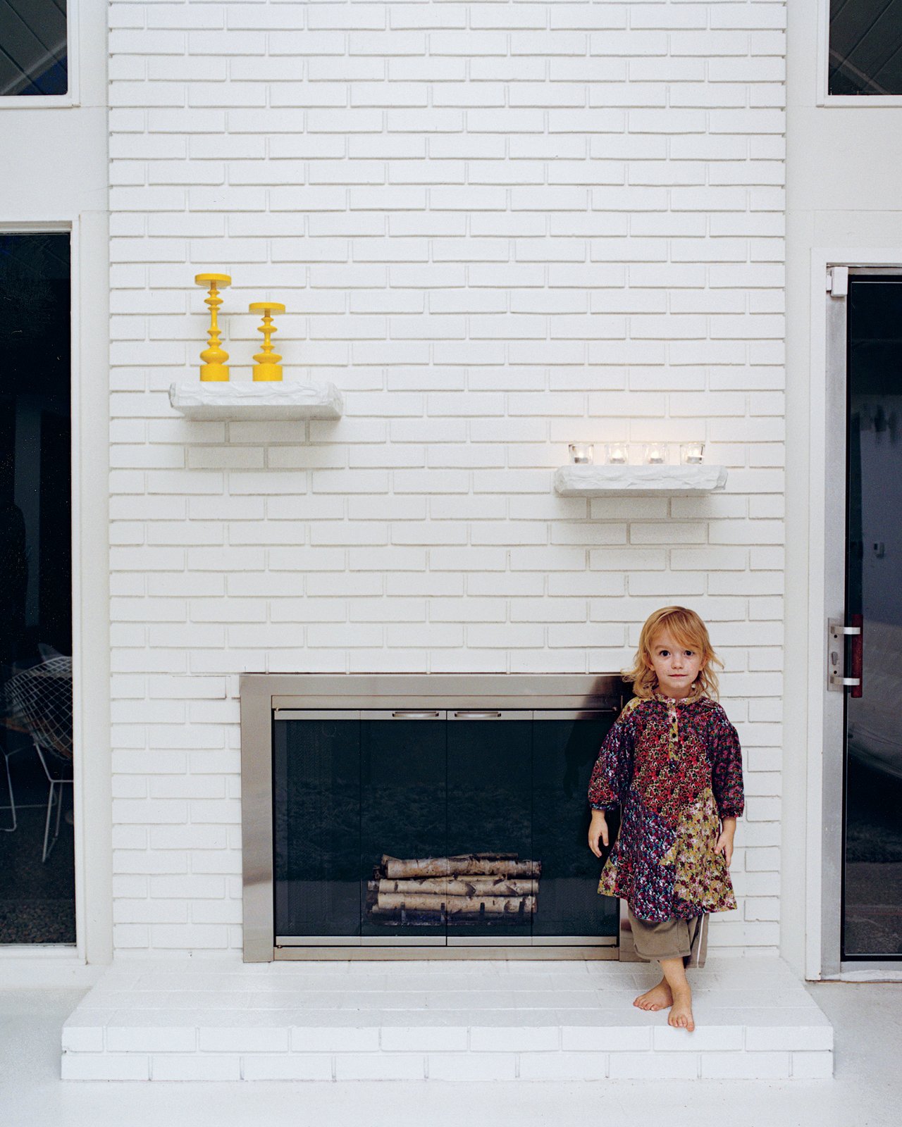 Jennifer and Mattias Segerholt renovated a five-bedroom, 2,400-square-foot post-and-beam house in Portland, Oregon. Though the house's features were a complete mess upon purchase, its form was perfectly preserved, including the covered fireplace.