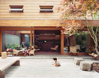Four-year-old Ian plays in the courtyard, which is the center of family life in warmer months.