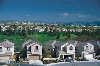 Home developments built around golf courses are often designed as insular sites that disregard the opportunities for social interaction presented by community oriented landscape architecture.