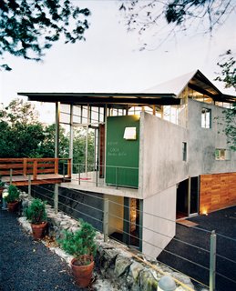Banks of windows and translucent panels help keep Casa Tuscania nice and airy.