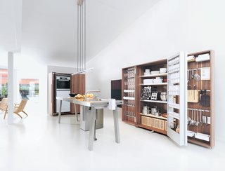 The Bulthaup b2 brings the woodshop into the kitchen with utilitarian workspaces and pristine, orderly wooden cabinet systems.