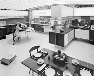 A display from the American National Exhibition in Moscow, 1959, depicting a woman in the "Miracle Kitchen," where automation has reduced her domestic workload.