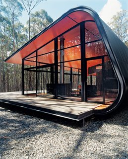15 Modern Homes with Black Exteriors - Photo 3 of 15 - It looks dramatic, but the building has very little physical impact on the landscape. "It’s anti-monumental," Judd says. "There’s no reason why you couldn’t pick it up and move it elsewhere."