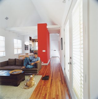 Kaplan and his dog Bella were able to splurge on a sofa from Ligne Roset after the house priced out at less that $100 per square foot.
