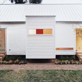 The Shot-Trot's two bathrooms are housed in eight-by-eight cubes that cantilever off the main space while maintaining the preordained grid.