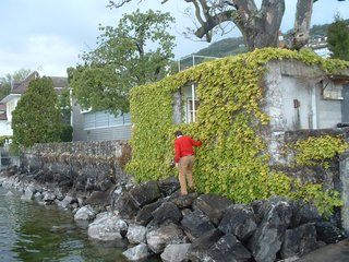 Architectural Trespassing - Photo 3 of 3 - Climbing across the rocks to sneak onto the grounds of Le Corbusier's Villa Le Lac in Corseax, Switzerland. Photo by Illya Azaroff.
