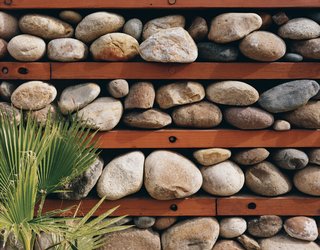 Casa Study House #1 - Photo 8 of 10 - One of Levine’s design experiments is this "thermal rock wall" of loosely stacked stones.