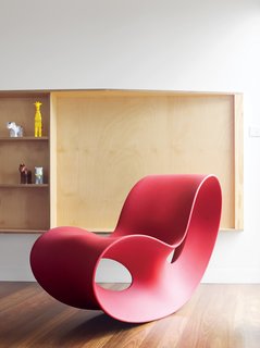 Ferguson’s prized Voido rocking chair is positioned by a living-room window that affords views of the small town and its beach. Designed in 2002 by Ron Arad for Magis, the Voido is blow-molded entirely from polyethylene.
