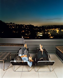 Joe Day and Nina Hachigian relax on their terrace overlooking the hills in Silver Lake area of Los Angeles.