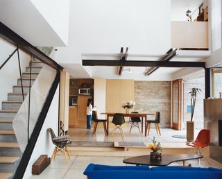 When Los Angeles architects Alice Fung and Michael Blatt began building their own home, they became their own ideal clients: Open to adventurous ideas, but still within the mainstream. They were also mindful of the historic Mount Washington neighborhood on which the home is built, avoiding the locale's development trend toward too-high dwellings. A high ceiling in the living room is architecturally stunning, but also serves a neat purpose of better capturing the home's northern-slope light. Modern and livable, Eames chairs are equally at ease with a sod seat on the deck. Take a peek into Domestic Democracy.