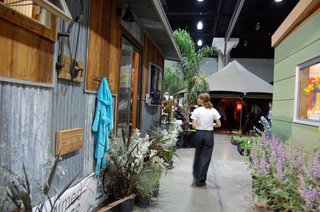 At left, an outdoor shower is installed outside Reclaimed Space's 400-square-foot structure. Modern Shed is at right.