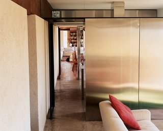 Clemente and her partners used the geometry of the podere as their guide for the house’s design, creating a glazed living room that is cleaved in half by a line (a hallway at one point, a wall in another) that connects visually and spatially with one of these old levees in the landscape. With Podere 43, the architects successfully emphasized and made visible the topography of the Tuscan landscape in the building itself.