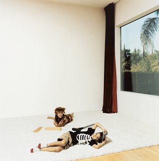 Mateo and Olivia lounge in the living room that doubles as a screening room.