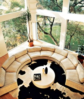 Home Cooking - Photo 8 of 8 - The curvy, off-white sofa, which forms a perfect conversation pit, was purchased on Ebay (and cost as much as it did to buy).