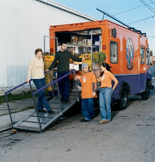 Bringing Beets to the Streets - Photo 1 of 1 - Jane Watson, Paul McElwee, Brahm Ahmadi, and Malaika Edwards stand by their work.