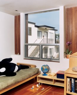 Two Houses Are Better Than One - Photo 8 of 13 - The girls’ room features wood furniture designed by Bornstein.