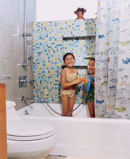 Two Houses Are Better Than One - Photo 10 of 13 - The sisters in their colorful bathroom with Kohler fixtures.