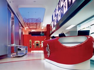 Like the aesthetics of Bolidism, a movement Iosa Ghini founded in 1985, fluid curves characterize many of his designs. Seen here is the interior of the Ferrari store in Rome, which he designed in 2004.