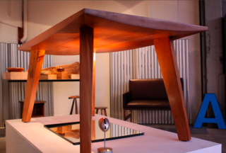 Ford + Ching Comes to Oakland - Photo 2 of 8 - Andrew Riiska's Belly table is gently bowed down below, with detailing on the flat top surface. A seriously sturdy, good-looking piece.