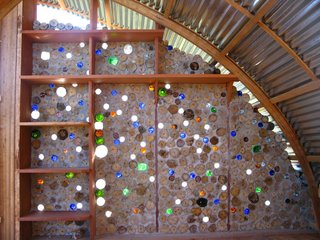 Nonn and Martin collected bottles from the roadside for use in the walls. The bottles let colored light filter into the cabana, and passing breezes create sound effects on the mouths of the bottles.