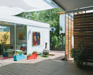 The Shipping Muse - Photo 10 of 23 - The 400-square-foot deck between the main house and guest quarters catches a cool breeze—a big bonus during Houston’s "super-summers"—and is often filled with the couple and their friends enjoying local microbrews. "The challenge was how to stitch together the house and the guest container without it looking like at the last minute we decided we needed a little more space," Robertson says.