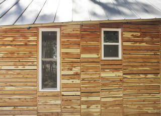 By the Book - Photo 4 of 8 - The students also attempted to appease residents by making their home "of the area." They based the design on vernacular shotgun houses and bought the cedar siding as off-cuts from a local lumberyard, which totaled $120.<br><br>Photo by <br><br>Ty Cole