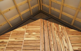 By the Book - Photo 5 of 8 - Grubb and her classmates designed a double-roof system for improved ventilation. The exaggerated overhang protects the home and its residents from the elements.<br><br>Photo by <br><br>Ty Cole