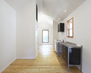 By the Book - Photo 6 of 8 - The Pattern Book House is a modest 292 square feet in size. "We were going for quality over quantity," Grubb says. "We were able to make it feel bigger than it is with the vaulted ceiling and the up-lighting."<br><br>Photo by <br><br>Ty Cole
