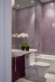 Noe Valley Renovation - Photo 13 of 17 - The main-level bathroom is finished quite similarly to that of the master suite: an Arcitec sink and Stark 2 toilet by Duravit, a crystal sconce by Eurofase, and tiles by Bisazza.<br><br>Photo by <br><br>Sharon Risedorph