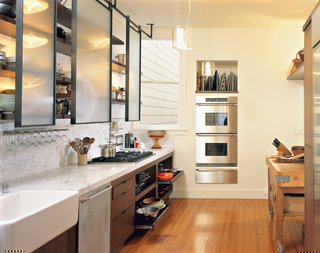 Prized possessions such as the old English butcher’s block sit cheek-to-jowl with 21st-century amenities, such as the stacking ovens by Dacor, six-burner Viking stove, and Miele dishwasher.