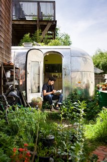 The Airstream is tucked into the back garden of a Berkeley co-op. Having a garden at my footsteps and chickens just over the fence make it feel peaceful and private.