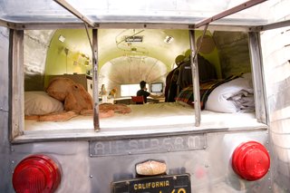 I did restoration work on the exterior as well. Polishing the aluminum skin was an exercise in patience! I restored the lights, and retouched the original license plate. I wanted the space to be alluring from all angles, inside and out.