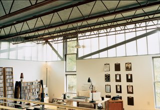 Sitting in the second-floor office, one has the feeling of being at the command center of a powerful battleship or futuristic spacecraft. Desk, floor lamp, and CD racks were all designed by Moseley.