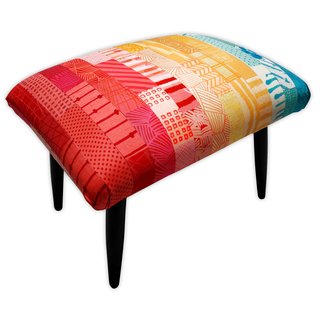 The Patchwork Footstool, which is covered in hand-dyed silk garnered from old wedding dresses.