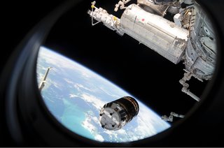 Backdropped by Earth's horizon and the blackness of space, the unpiloted Japanese H-II Transfer Vehicle (HTV) approaches the ISS. Once the HTV was in range, NASA astronaut Nicole Stott, Canadian Space Agency astronaut Robert Thirsk and European Space Agency astronaut Frank De Winne, all Expedition 20 flight engineers, used the station's robotic arm to grab the cargo craft and attach it to the Earth-facing port of the Harmony node. The attachment was completed at 5:26 (CDT) on Sept. 17, 2009. The Japanese Kibo complex (top right) and the Canadarm2 (bottom right) are also visible in the image. Photo taken September 17, 2009. Image courtesy of NASA.