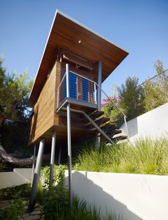An Atypical Tree House - Photo 8 of 11 - Metaphorically, architect Chris Kempel said, the Kynar-painted steel columns are trees. "It was like taking a box and poking it with chopsticks."