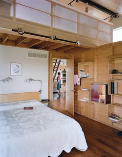 Farm Fresh - Photo 2 of 10 - The slatted wall that divides the sleeping and living quarters has maple-ply boxed shelves that can be rearranged.