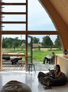 Like the barns Barache scampered through as a child, the house divides its length between loftlike open spaces like the living room, which opens onto a small deck perfect for open-air lolling, and stacked-box nooks and crannies.